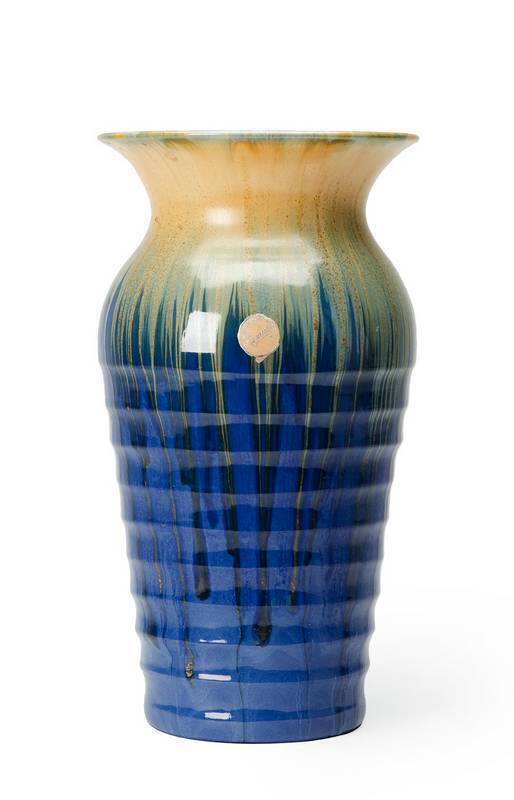 REMUED: Blue glazed pottery vase with flared rim, incised signature & original foil label. 31.5cm