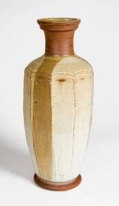 HAROLD HUGHAN: Art pottery vase c1970 with cut sided, feldspa & iron glaze in browns & cream. Full hand written signature to base & incised monogram to the side. Vases if this size seldom seen. Height 51cm&nbsp;