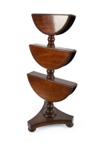 An antique English mahogany three tier drop-side revolving dumbwaiter with tri-form base, mid 19th century, 126cm high, 60cm diameter.
