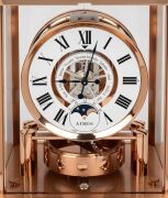 JAEGER LECOULTRE "Classique Phases De Lune" Atmos clock in rose gold plated case, with month and phases of the moon, circa early 2000s, 23cm high. - 2
