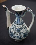 A Ming Dynasty porcelain pot (A/F), a Chinese blue and white porcelain water pot in the Yuan style (unknown age), together with an antique Chinese export ware blue and white porcelain meat platter (A/F), 18th/19th century, (3 items), the platter 46cm wide - 2
