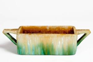 JOHN CAMPBELL: Pottery flower trough with Art Deco style handles, green & yellow glaze. Height 10cm, width 37cm, depth 10cm