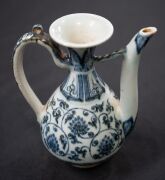A Ming Dynasty porcelain pot (A/F), a Chinese blue and white porcelain water pot in the Yuan style (unknown age), together with an antique Chinese export ware blue and white porcelain meat platter (A/F), 18th/19th century, (3 items), the platter 46cm wide - 4