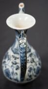 A Ming Dynasty porcelain pot (A/F), a Chinese blue and white porcelain water pot in the Yuan style (unknown age), together with an antique Chinese export ware blue and white porcelain meat platter (A/F), 18th/19th century, (3 items), the platter 46cm wide - 5