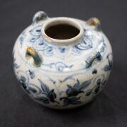 A Ming Dynasty porcelain pot (A/F), a Chinese blue and white porcelain water pot in the Yuan style (unknown age), together with an antique Chinese export ware blue and white porcelain meat platter (A/F), 18th/19th century, (3 items), the platter 46cm wide - 6