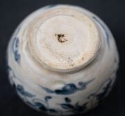 A Ming Dynasty porcelain pot (A/F), a Chinese blue and white porcelain water pot in the Yuan style (unknown age), together with an antique Chinese export ware blue and white porcelain meat platter (A/F), 18th/19th century, (3 items), the platter 46cm wide - 7