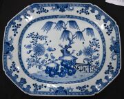 A Ming Dynasty porcelain pot (A/F), a Chinese blue and white porcelain water pot in the Yuan style (unknown age), together with an antique Chinese export ware blue and white porcelain meat platter (A/F), 18th/19th century, (3 items), the platter 46cm wide - 8