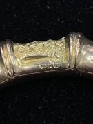 An antique gold plated silver bangle, a sterling silver bangle with leaf decoration, two pairs of antique sterling silver cufflinks, and two watch chains, 19th/20th century, (6 items). - 3