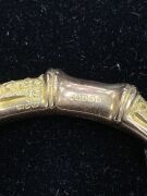 An antique gold plated silver bangle, a sterling silver bangle with leaf decoration, two pairs of antique sterling silver cufflinks, and two watch chains, 19th/20th century, (6 items). - 4