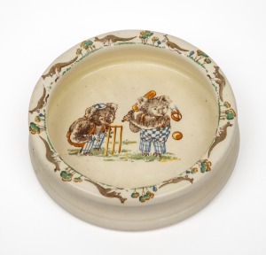 A Falcon ware 'playtime' childrens bowl decorated with koalas playing cricket, English, 20th century, 16 cm diameter.