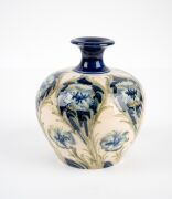 MOORCROFT "Florian Ware" pattern pottery on cream ground, stamped "Florian Ware, J.S. MacIntyre & Co. Ld., Burslem, England" plus green "Moorcroft" signature mark, 14cm high. - 6