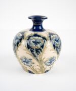MOORCROFT "Florian Ware" pattern pottery on cream ground, stamped "Florian Ware, J.S. MacIntyre & Co. Ld., Burslem, England" plus green "Moorcroft" signature mark, 14cm high. - 7