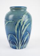 MOORCROFT "Wind Swept" salt glazed pottery vase on blue ground, impressed signature mark to base "Moorcroft, Potter To H.M. The Queen, Made In England", 24.5cm high. - 6