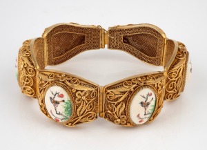 A vintage Chinese gilt finished filigree silver bracelet with five hand-painted ivory panels, 20th century, stamped "SILVER", 19cm long