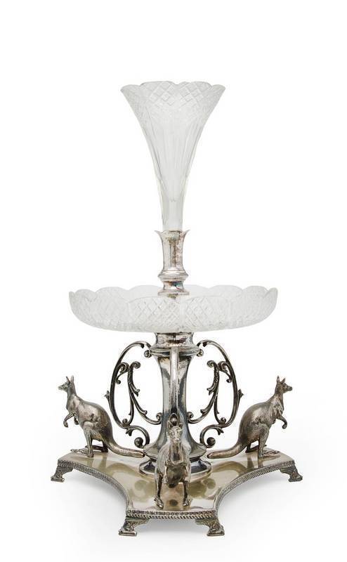 KANGAROO CENTRE PIECE: Silver plated triform base decorated with 3 kangaroo figures, cut crystal bowl & trumpet. Distributed by A.Saunders of Sydney. Height 49cm