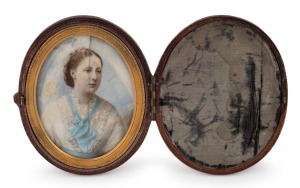 An antique English oval miniature portrait of a lady in blue and white, hand-painted on ivory, housed in original scarlet leather and silk lined case with embossed retailer's details "LOCK & WHITFIELD 178 REGENT ST.", 19th century, 9.5cm high overall
