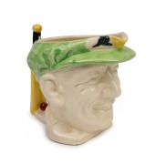 1936 Don Bradman toby jug manufactured by Marutomo Ware, with cap in green, height 15cm.