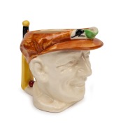 1936 Don Bradman toby jug manufactured by Marutomo Ware, with cap in brown, height 15cm.