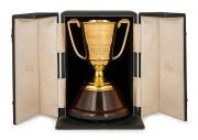 HOBART CUP, TASMANIAN RACING CLUB, 1952: Won by Royal Release. Fine quality two handled trophy cup in solid 9ct gold (237 grams), mounted on turned timber plinth and housed in original presentation case branded "Rundle's, Hobart", the cup 15cm high, 20cm 