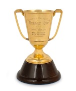 HOBART CUP, TASMANIAN RACING CLUB, 1952: Won by Royal Release. Fine quality two handled trophy cup in solid 9ct gold (237 grams), mounted on turned timber plinth and housed in original presentation case branded "Rundle's, Hobart", the cup 15cm high, 20cm - 2