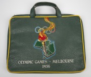 1956 MELBOURNE OLYMPICS: Seat cushion from the opening ceremony, chocolate tin, boomerang ornament and badge; together with SYDNEY 2000 badges and medallions, (qty). - 2