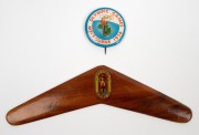 1956 MELBOURNE OLYMPICS: Seat cushion from the opening ceremony, chocolate tin, boomerang ornament and badge; together with SYDNEY 2000 badges and medallions, (qty). - 3