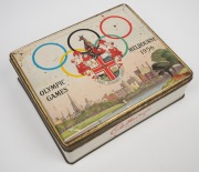 1956 MELBOURNE OLYMPICS: Seat cushion from the opening ceremony, chocolate tin, boomerang ornament and badge; together with SYDNEY 2000 badges and medallions, (qty). - 4
