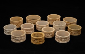 Thirteen assorted antique and vintage Chinese carved ivory napkin rings, most with dragon decoration, 19th and 20th century.