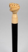 An antique walking stick with carved marine ivory snake and fist hand grip, ebony shaft and brass ferrule, 19th century, ​​​​​​​83cm high. - 3