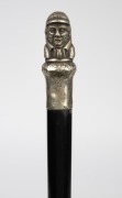 An antique walking stick with silver plated figural handle, ebonised timber shaft and brass ferrule, 19th century, 88cm high. - 2