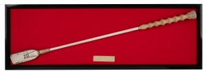 BLUE DIAMOND STAKES WINNER "PAINT" JOCKEY WHIP used by Danny Nikolic, framed and mounted with brass presentation plaque; together with a hand-written letter authenticating the whip and signed by the jockey, (2 items), the frame 22 x 64cm overall.