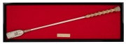 BLUE DIAMOND STAKES WINNER "PAINT" JOCKEY WHIP used by Danny Nikolic, framed and mounted with brass presentation plaque; together with a hand-written letter authenticating the whip and signed by the jockey, (2 items), the frame 22 x 64cm overall.