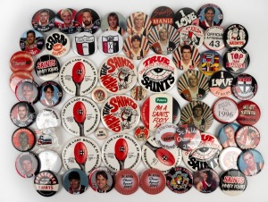 ST KILDA: A collection of round button badges issued in years spanning the 1960s to the 2000s, including both club and player images, noted Danny Frawley and Robert Harvey. (60+ items)