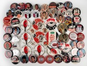 ST KILDA: A collection of round button badges issued in years spanning the 1960s to the 2000s, including both club and player images, noted Danny Frawley and Robert Harvey. (60+ items)