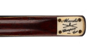 Alcock & Co. Melbourne "Champion Cue" (2nd edition), length 58 inches, ash shaft, ebony butt edged with maple and green veneers, ivory plate, c. 1940s.