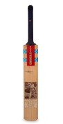 Don Bradman's original signature on a full-size Gray-Nicolls cricket bat, featuring photograph of Bradman and career statistics; length 83 cm.