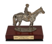 BLUE DIAMOND STAKES: 2003 winner's trophy for Kusi, Royal Selangor pewter statuette by sculptor R. Cameron, on timber plinth with plaque that reads "Thoroughbred Club of Australia, John Hawkes - Trainer, Kusi, 2003 AAMI Blue Diamond Stakes Winner, Melbour
