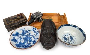 New Zealand timber tray, bamboo tray, antique metal cash box, wooden mask, Chinese blue and white bowl, a Japanese blue and white platter, 20th century, and vintage camera, (7 items), the largest 48cm wide.