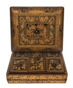 An antique Chinese export ware lacquered box with gilt decorated finish, bearing family crest with the motto "IN VERO RIGHT", interior handsomely fitted with five lidded compartments also beautifully decorated in the chinoiserie style and bearing the same