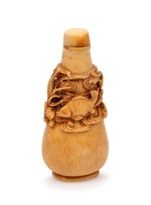 A Chinese ivory scent bottle with pierced and carved marine decoration adorned with fish swimming in reeds, square seal mark to base, 19th/20th century, 8.5cm high.
