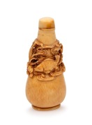 A Chinese ivory scent bottle with pierced and carved marine decoration adorned with fish swimming in reeds, square seal mark to base, 19th/20th century, 8.5cm high.