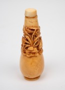A Chinese ivory scent bottle with pierced and carved marine decoration adorned with fish swimming in reeds, square seal mark to base, 19th/20th century, 8.5cm high. - 2
