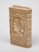 An antique carved ivory snuff box in book form with male and female portraits, 18th/19th century, ​​​​​​​7.5cm high. - 3