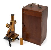 Brass and steel microscope, 19th century, 28.5cm at highest setting, in timber box with miniature drawer (key present).