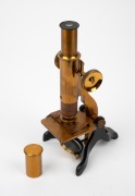 Brass and steel microscope, 19th century, 28.5cm at highest setting, in timber box with miniature drawer (key present). - 2