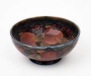 MOORCROFT "Pomegranate" pottery bowl on blue ground, impressed "Moorcroft, Made In England", 7cm high, 16cm diameter.