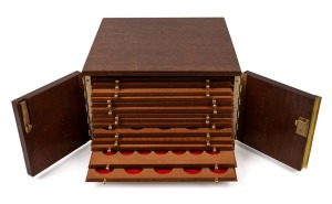 A vintage coin collector's cabinet, crafted from Australian hardwood, 20th century, ​​​​​​​18cm high, 30cm wide, 30cm deep.