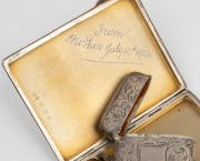 An antique sterling silver vesta, sovereign case and cigarette case, 19th and 20th century, (3 items), 129 grams total. - 2