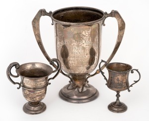 Three sterling silver trophy cups, 20th century, the largest 17cm high, 405 grams total.