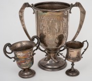 Three sterling silver trophy cups, 20th century, the largest 17cm high, 405 grams total. - 2